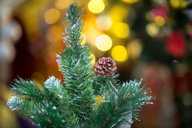 istock Decorations on christmas tree at night with bokeh on background, soft focus 884440342