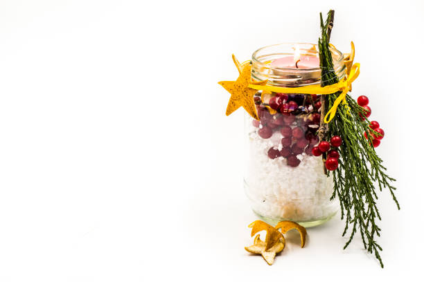 istock christmas hand made candle with red berries craft isolated on white 884447756