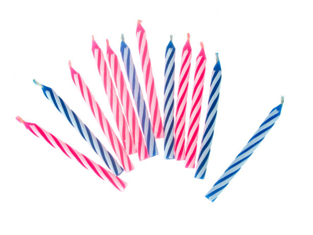 istock Birthday cake small candles isolated on white, Pink and blue. 884453246