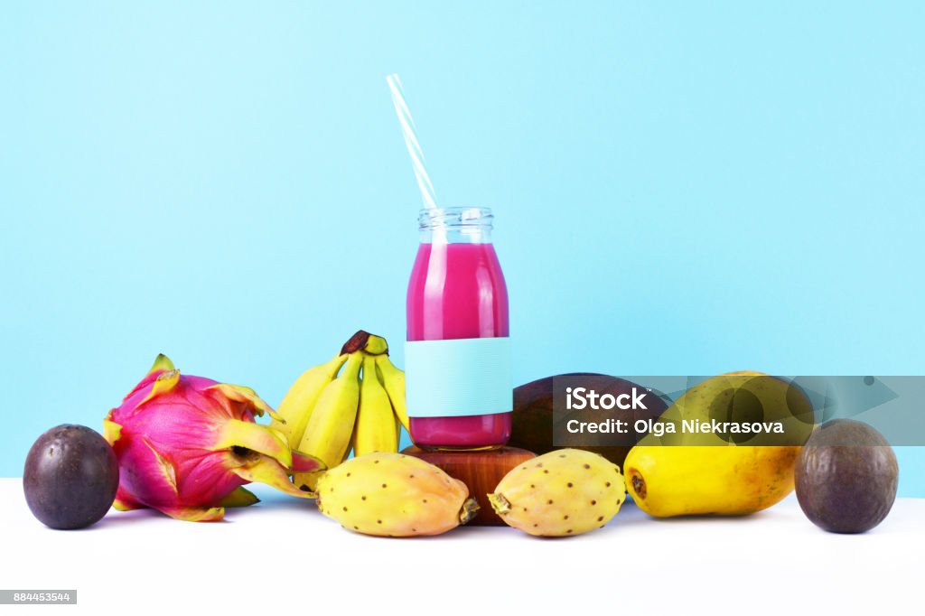 Healthy lifestyle concept: pink smoothie with tropical fruits on white table. Antioxidant Stock Photo