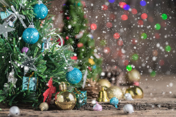 istock closed up of Christmas tree with gift on old wood 884460330