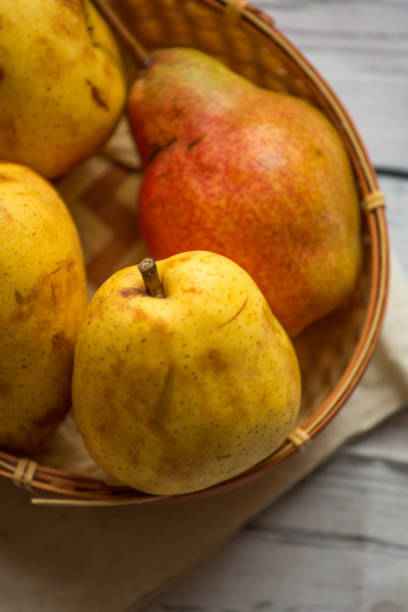 istock Fruit background. Fresh organic pears on old wood. Pear autumn harvest 884462986