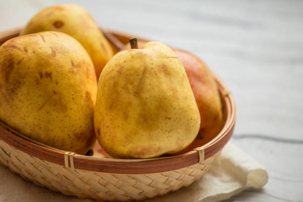istock Fruit background. Fresh organic pears on old wood. Pear autumn harvest 884462994