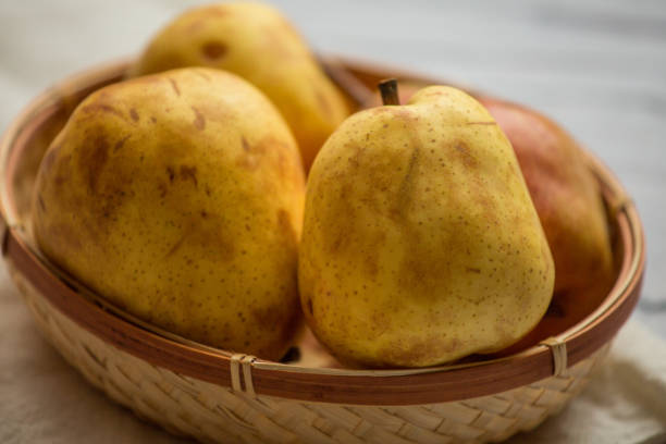 istock Fruit background. Fresh organic pears on old wood. Pear autumn harvest 884462998