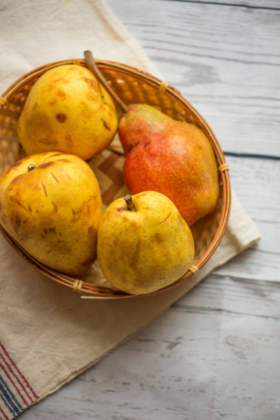 istock Fruit background. Fresh organic pears on old wood. Pear autumn harvest 884463022