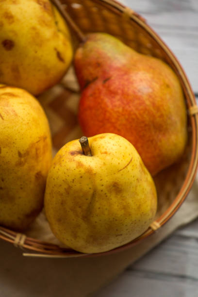 istock Fruit background. Fresh organic pears on old wood. Pear autumn harvest 884463024