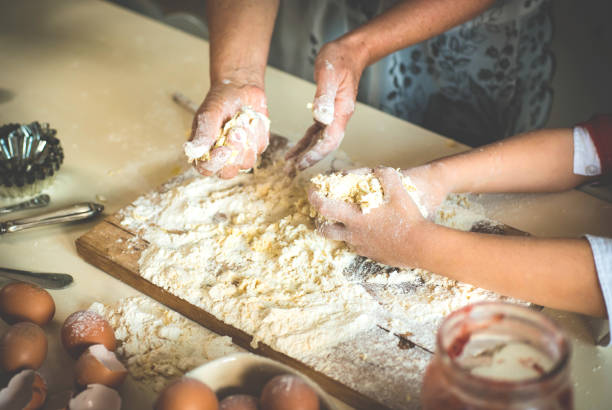 istock Woman and Child Making Cookies 884468332