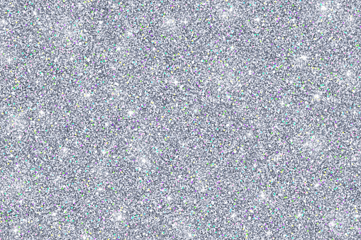 Glitter texture of silvery color, abstract silver background