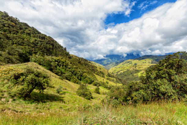 Jeep Trip Dramatic clouds over a valley in Tolima, Colombia. tolima stock pictures, royalty-free photos & images