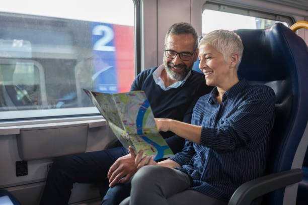 istock Mature couple traveling by train 884495798
