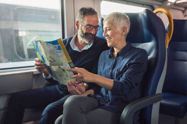 istock Mature couple traveling by train 884498130