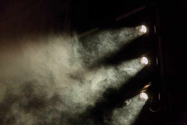 istock The light rays from the spotlight through the smoke. Theater lighting equipment 884498722