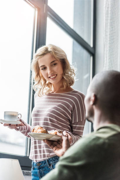istock woman with breakfast in hands 884502294