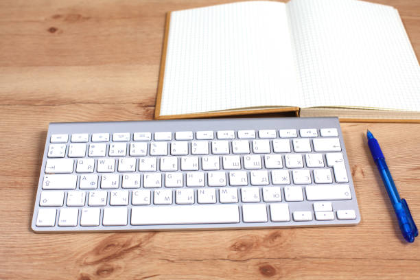 istock Workplace with notebook laptop Comfortable work table in office windows and city view 884502862
