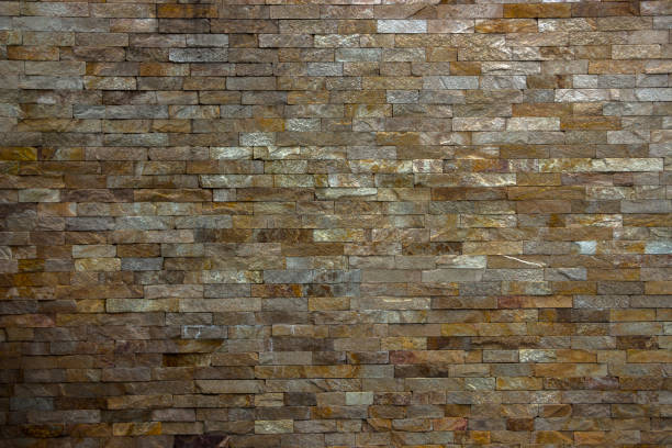 istock Fragment of artistic wall made with multiple stones 884502938