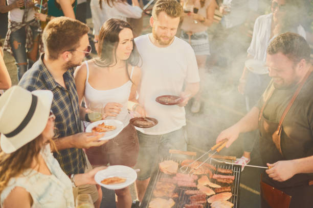 istock Group of people at barbecue party 884503036