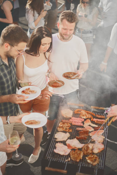 istock Group of people at barbecue party 884503048