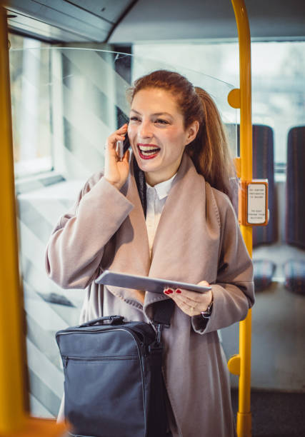 istock Businesswoman Taking Public Transport 884503064