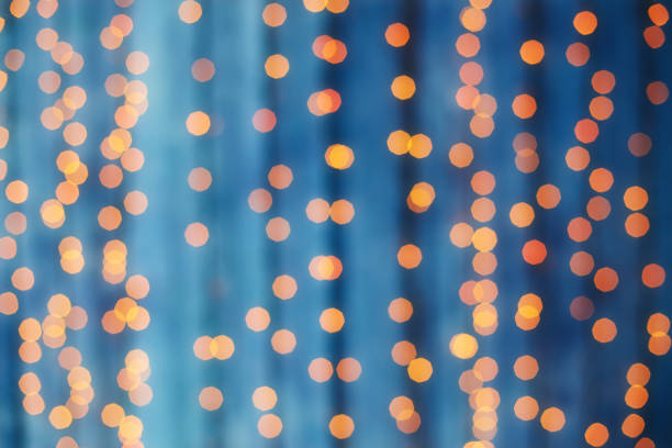 istock Blurred garland light bokeh. Christmas blur pattern, defocused blue background 884505320