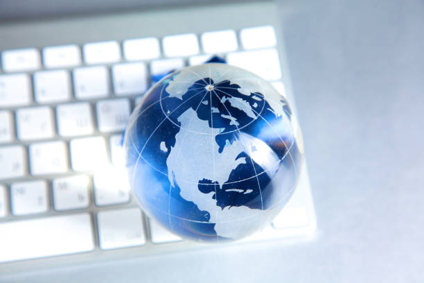 istock Cristal globe of the Earth on a Computer 884505326