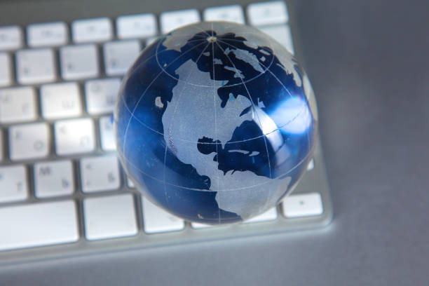 istock Cristal globe of the Earth on a Computer 884505428