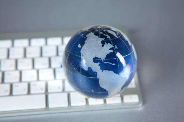 istock Cristal globe of the Earth on a Computer 884505488