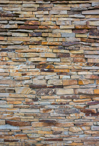 istock Fragment of artistic wall made with multiple stones 884505868