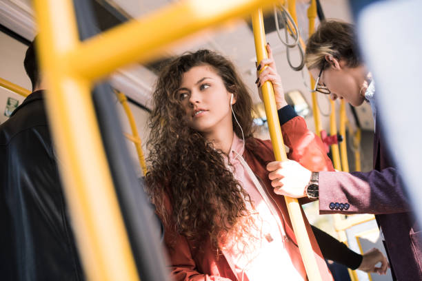 istock beautiful young woman in bus 884513436