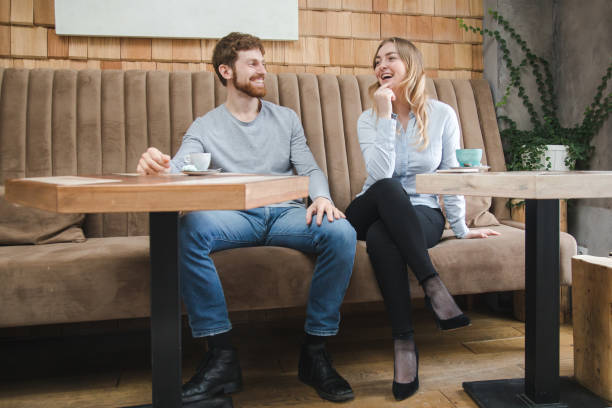 istock Laughing couple in cafeteria 884513694