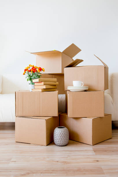 istock Cardboard boxes - moving to a new house 884518170