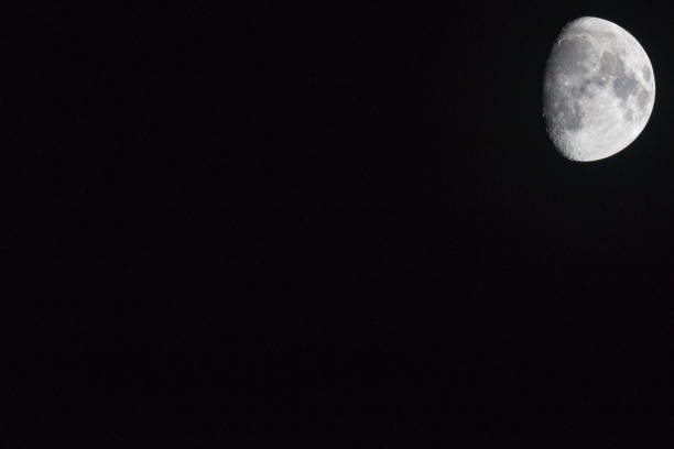 istock The moon oThe moon on a black backgroundn a black background 884518274
