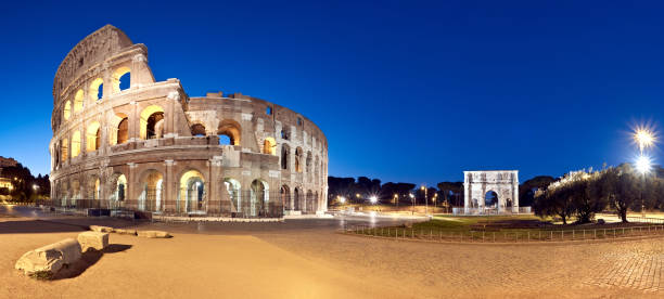 istock Colosseum (Coliseum) at night, Rome, Italy 884518442