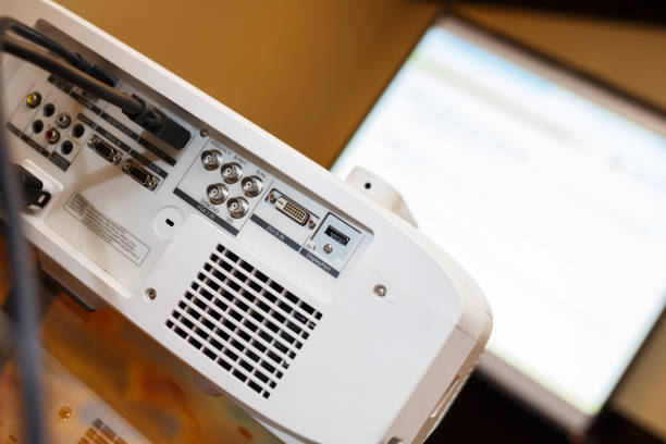 istock white projector on the table prepared to broadcast video presentation. 884518596