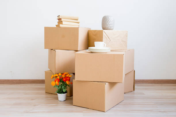 istock Cardboard boxes - moving to a new house 884521460