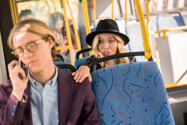 istock girl touching man in bus 884521788