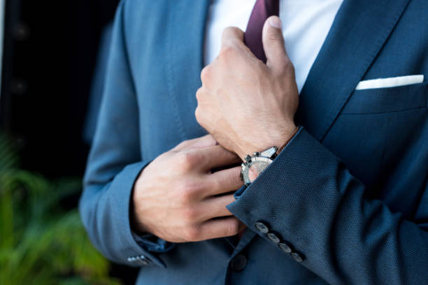istock businessman with wristwatch 884524428