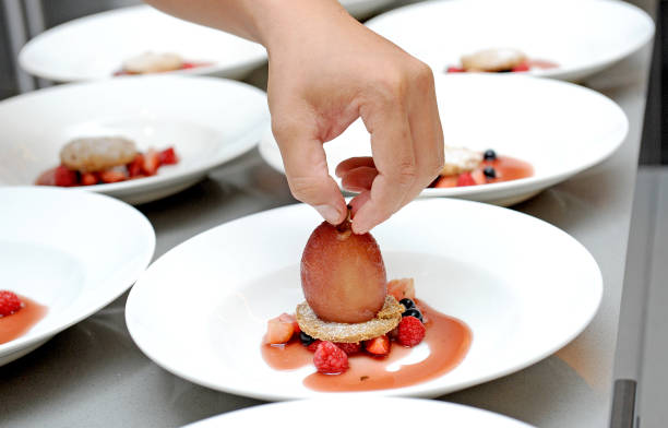 istock dessert of peaches and berries on hand 884524464
