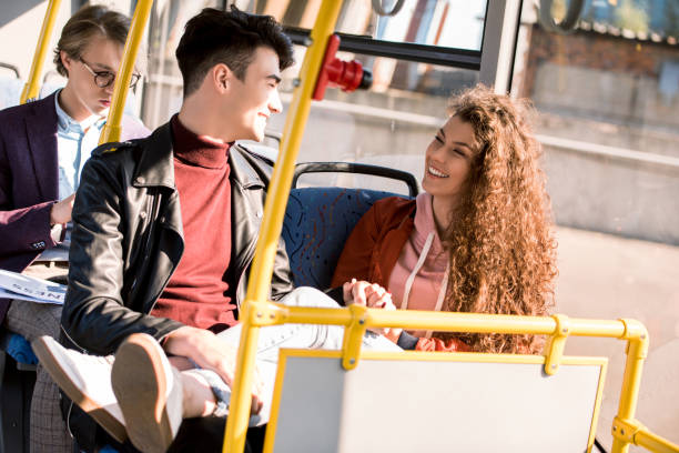 istock happy young couple in bus 884524520