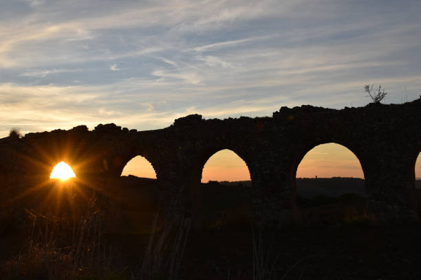 istock sunset view of ancient Roman aqueduct 884524704