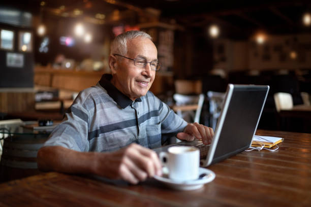 istock Senior man in coffee shop 884527990