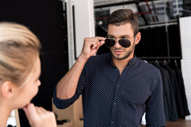 istock man wearing sunglasses in boutique 884528402