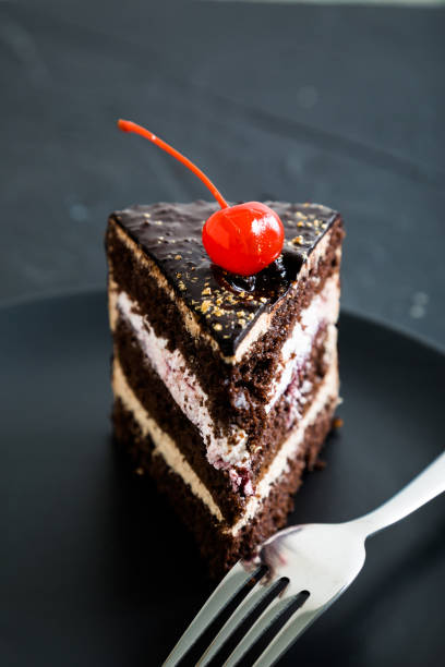 istock A piece of chocolate cake with cherries 884528622