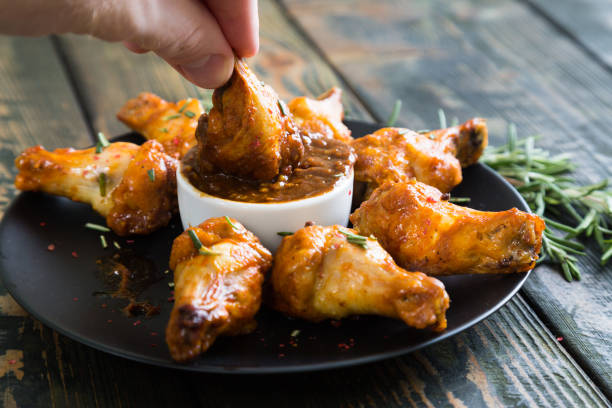 istock Fried chicken wings with spicy sauce 884553064