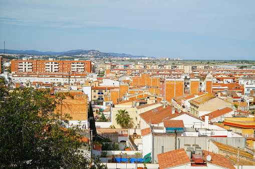Ve sobre los tejados de la de ciudad Malgrat Mar (España) desde el Cerro del Parc del Castell photo