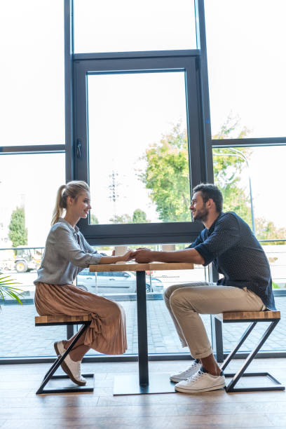 istock young couple in cafe 884559944