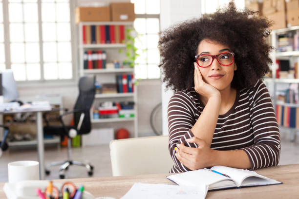istock Smiling woman resting at workplace 884564480