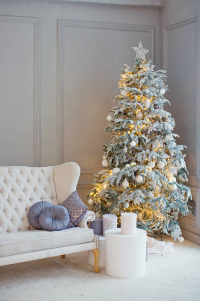 istock white vintage sofa and Christmas tree 884564602
