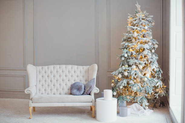 istock white vintage sofa and Christmas tree 884564972
