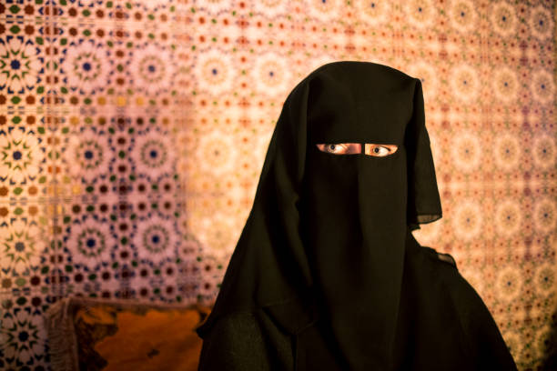istock Arab woman in traditional burqa 884565164