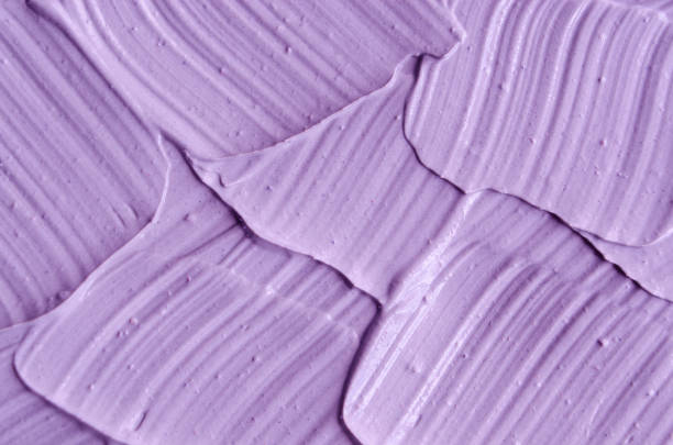 Lavender face cream (mask) texture close up. Brush strokes. Selective focus. Abstract background